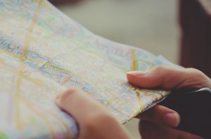 How to delete offline Google Maps - Person looking at a hardcopy map.