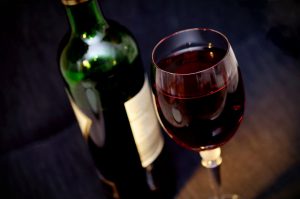 wine bottle and glass on a table