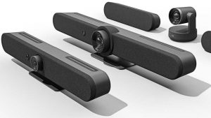 A series of Logitech devices featuring the Rally Bars and other cameras, black, sleek, rounded, with lenses and speakers covered with fabric and plastic.