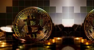 A bitcoin displayed with digital blocks cut into it artistically as a cryptocurrency display
