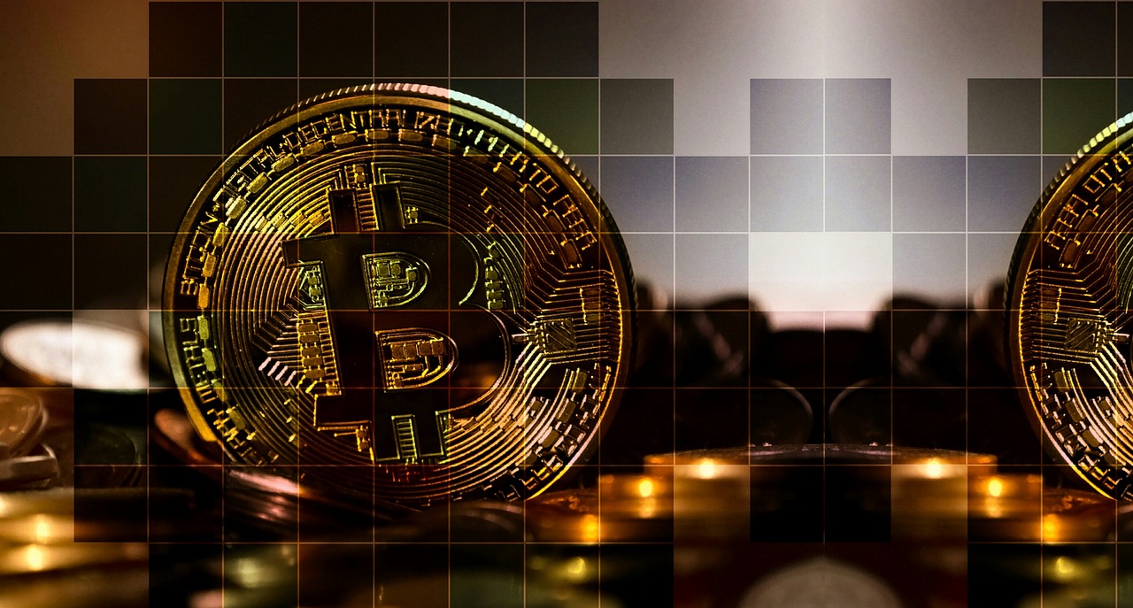 A bitcoin displayed with digital blocks cut into it artistically as a cryptocurrency display