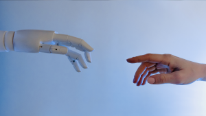 A human hand and a robot hand touch, in a story focused on enterprise AI data sovereignty.
