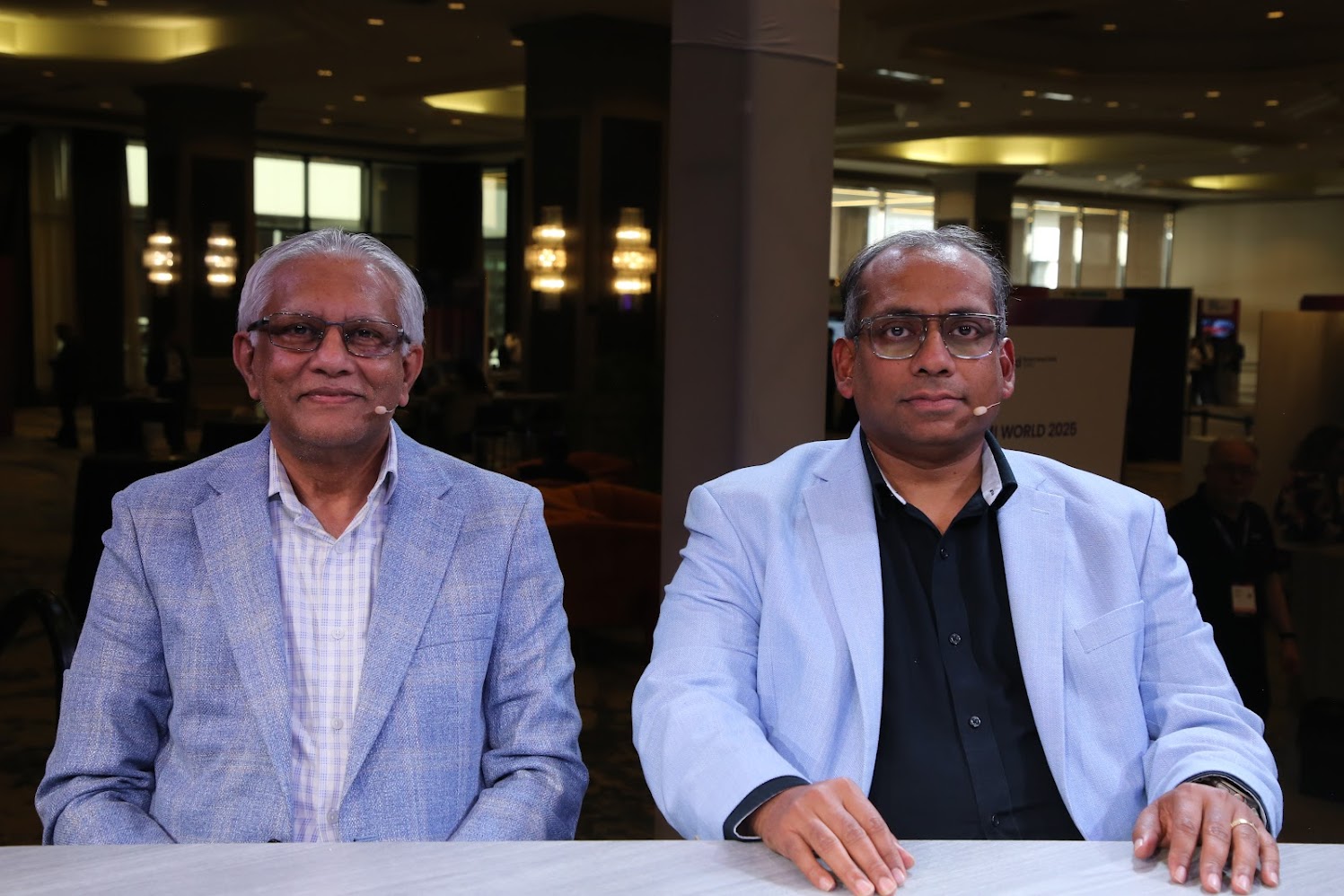 Reji Paul, Dir. at G-III Apparel, and Reetwick Ghosh, Sen. Dir, at Infosys, talk with theCUBE about application growth during Boomi World 2025.
