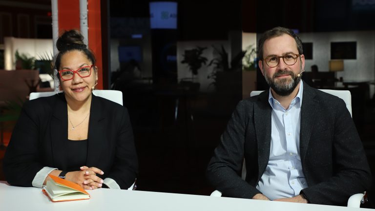 Misa Rawlins, managing director at consulting firm Deloitte Consulting LLC, and Alex Jackson, partner at Deloitte, talk with theCUBE during UiPath Fusion 2025.