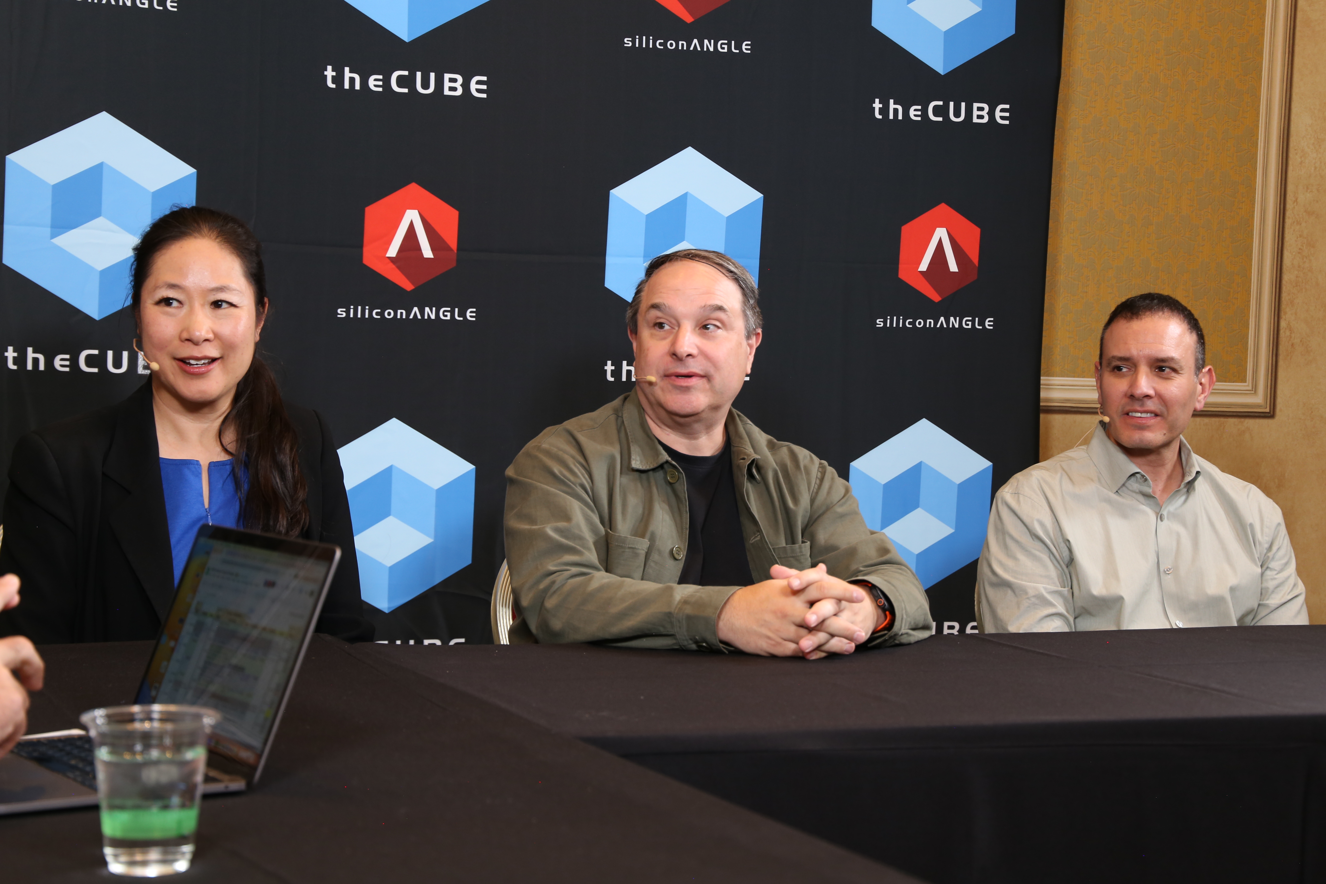 Julia Chen, VP of Partner Core at AWS, Robert Occhialini, CTO of the World Surf League, Gabriel Romero, CMO of AllCloud, discuss the new surfing smart watch with theCUBE's John Furrier at AWS reInvent 2025.