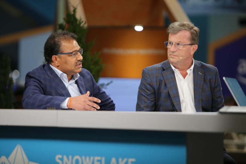 Vinayak Kagalkar, senior vice president, global chief information officer and chief technology officer of Clover Network LLC, a Fiserv company, and Mike Blandina, chief information officer of Snowflake Inc., talk with theCUBE about vibe coding, AI-assisted software development and change management at Snowflake Summit 2026.